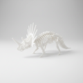 A white 3D-printed articulated Styracosaurus dinosaur skeleton model, shown from a side profile on a clean white background.