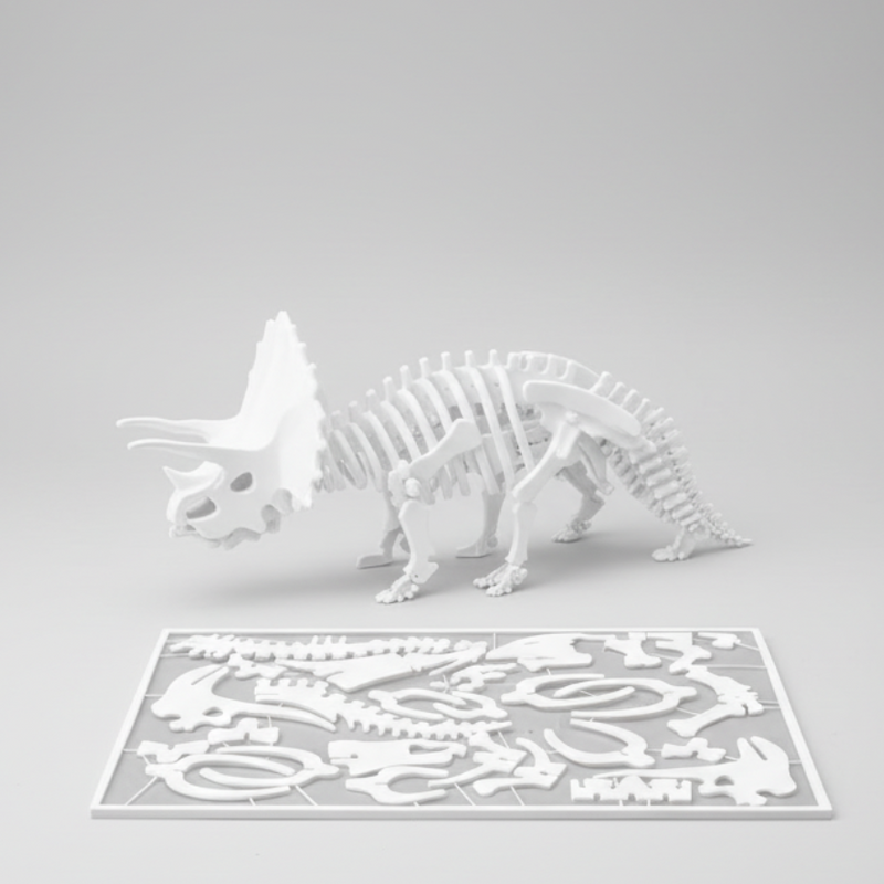 Dinosaur skeleton model on a table with a completed puzzle below